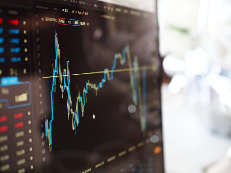 blue-and-yellow-graph-on-stock-market-monitor-159888-scaled